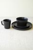 SET OF THREE BLACK CERAMIC DINNER PLATE, SALAD PLATE, BOWL