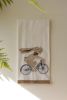 TEA TOWEL - EASTER RABBIT ON A BIKE